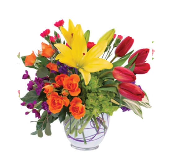 Majestic Jewels - Mother Nature is on a roll. Majestic Jewels highlights the beauty of  vibrant color. Red tulips are  are paired with other colorful lilies, spray roses, carnations and stock in this playful arrangement.	Approximately 15&quot;W X 15&quot;H Standard option is pictured.