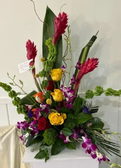 Exotic Splendor Exotic Splendor - The arrangement is further enhanced by the inclusion of purple orchids that cascade delicately, adding an exotic touch