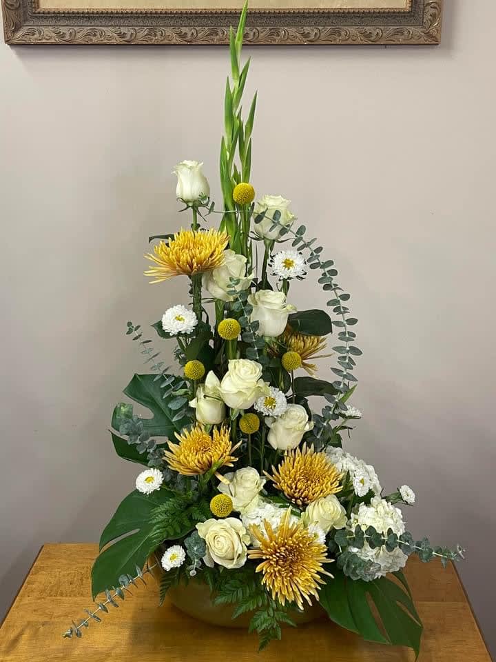 Towering Love - This sympathy arrangement is an expression of love and adoration for a loved one.  Delivered in a square ceramic bowl and towering flowers.  A beautiful statement piece.
