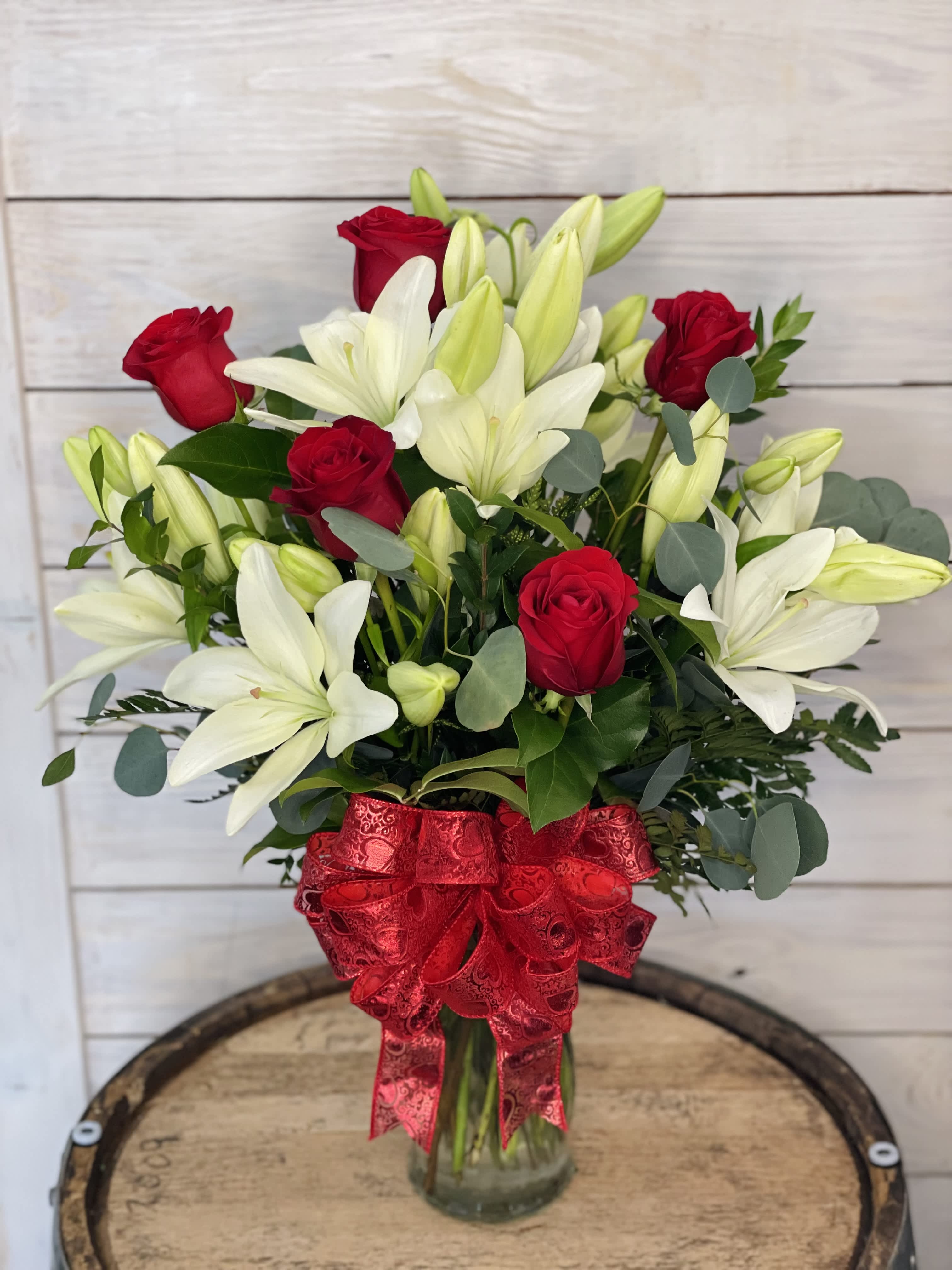 Lilies and Roses - Outstanding and stunning! 6 lilies and 6 roses in a vase with a mix of nice greenery.