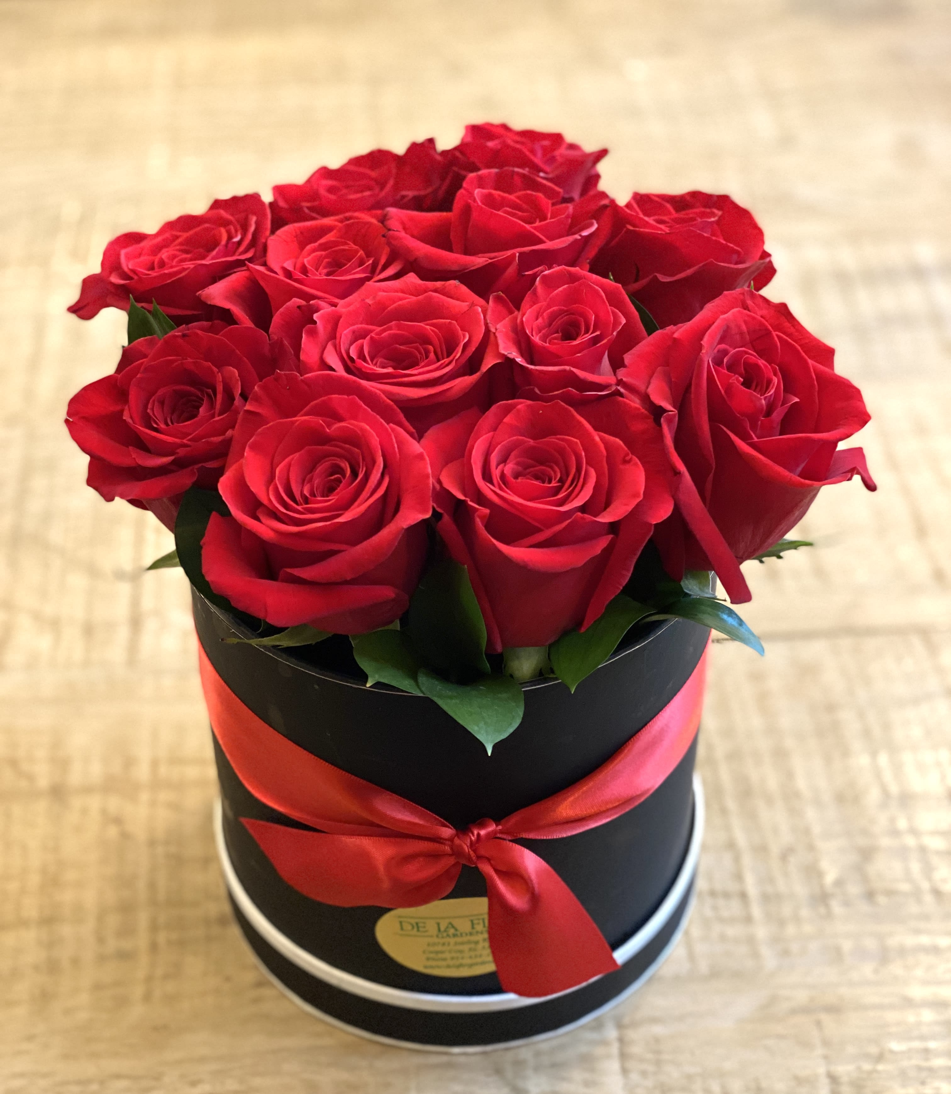 Red Rose Hatbox  - Enjoy a dozen premium red roses in an elegant hatbox. Available for pickup or local delivery only.