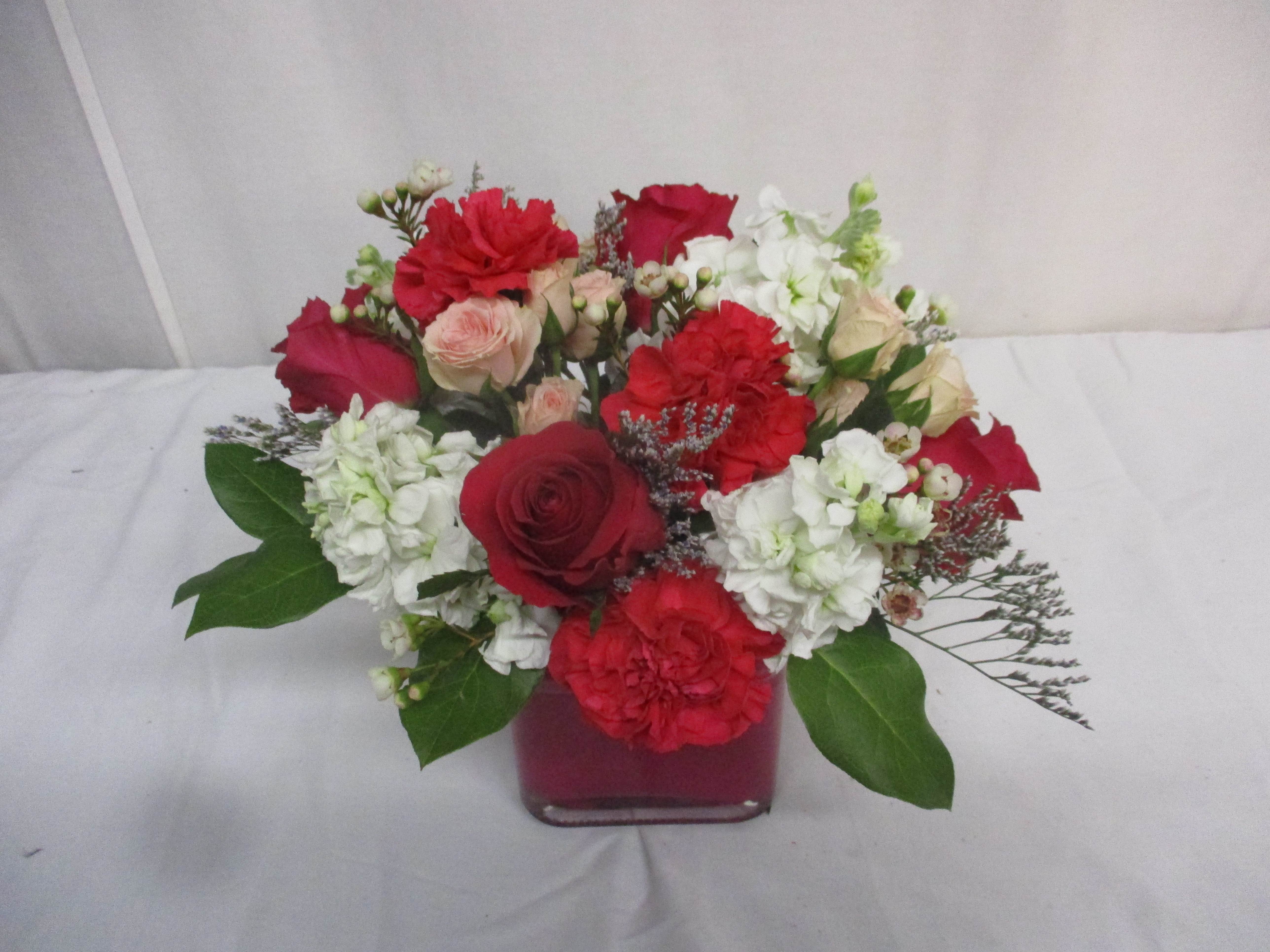 Cosmic Crush - This sweet arrangement features vibrant hot pink and light pink enhanced with refreshing white tones. A perfect way to send your love to someone close by, or across the miles.