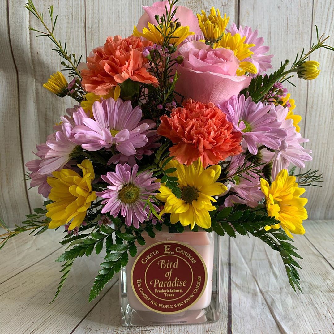 Candle &amp; Blooms - Circle E Candle is topped off with a beautiful spring mix of fresh cut flowers. Flowers &amp; a gift! 22 oz candle with 2 wicks.