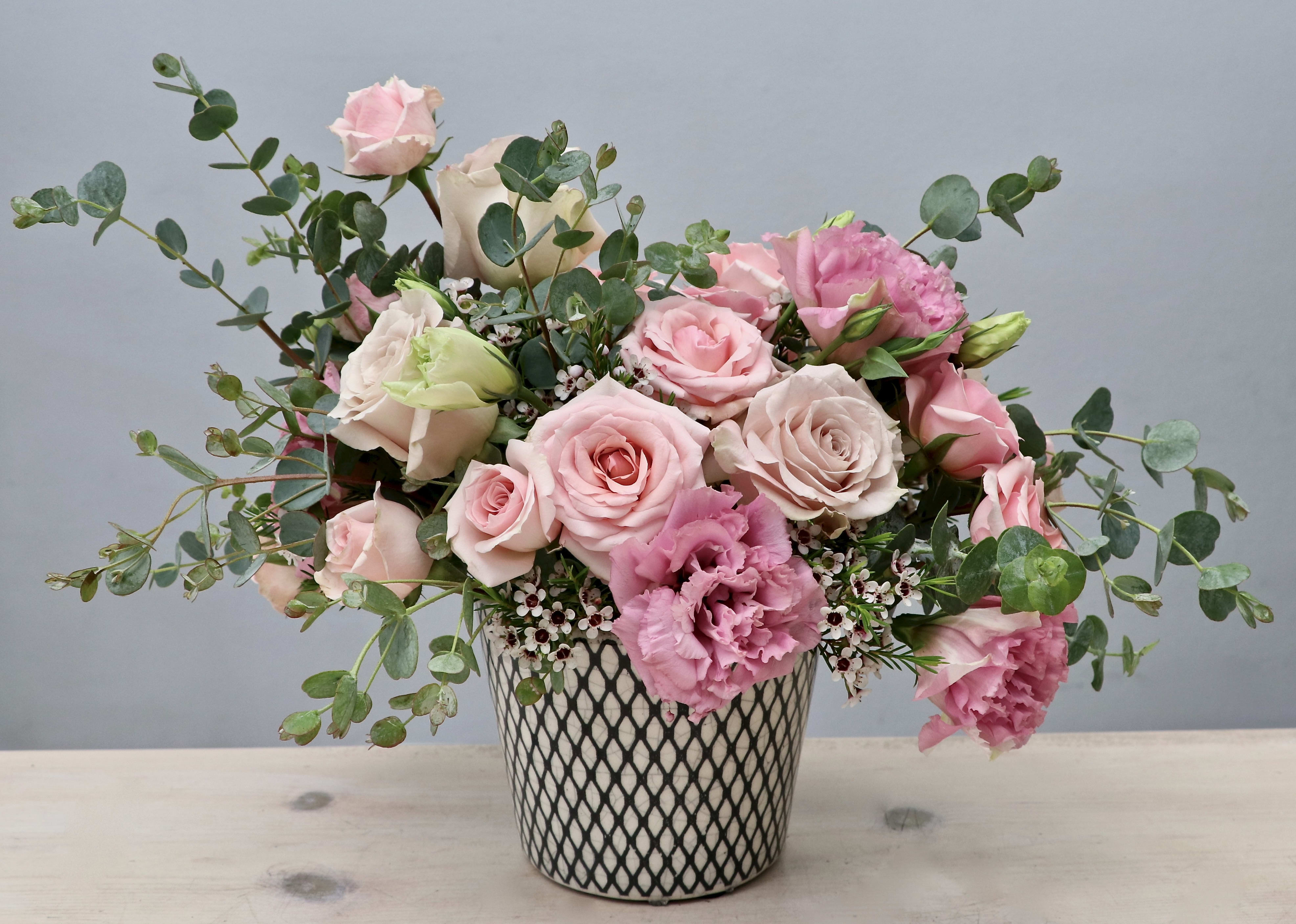Pink Sunshine - WeHo Pink Sunshine - WeHo - This arrangement really is a spark of sunshine. Sure to make any recipients smile as soon as they receive it. Full of pink roses, lisanthus, and eucalyptus. Standard size measures approximately 10x10'' make sure to upgrade for a larger size and a bigger impression.