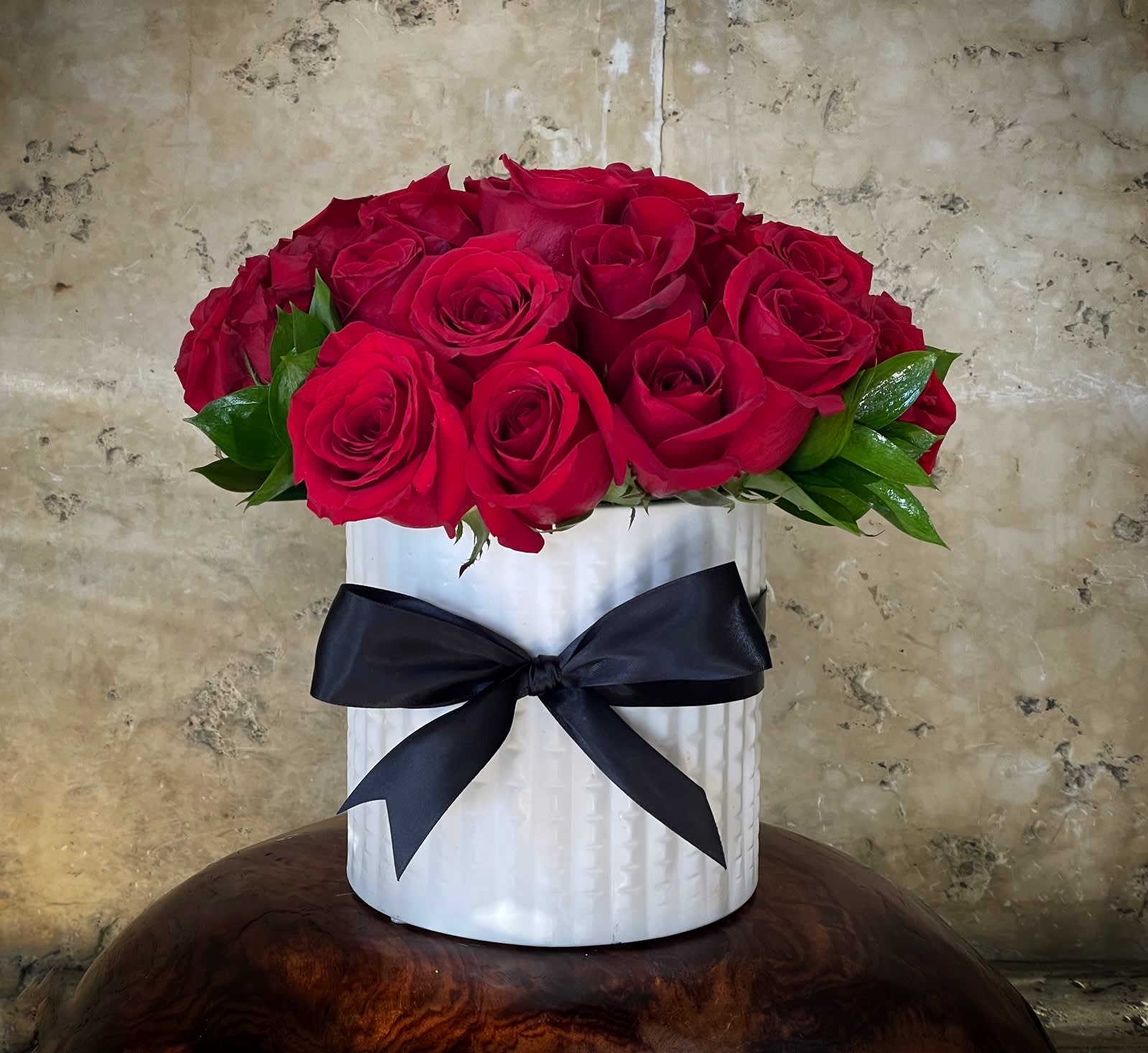 Amor  - Two Dozen premium red Roses, and Israeli Ruscus leaves in ceramic vase.