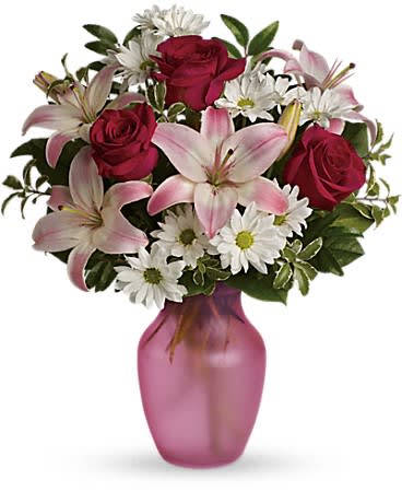 She's The One Bouquet - This beautiful arrangement consists of red Roses, white Daisies, and pink Lilies with mixed greenery in a glass vase **Vases will vary**