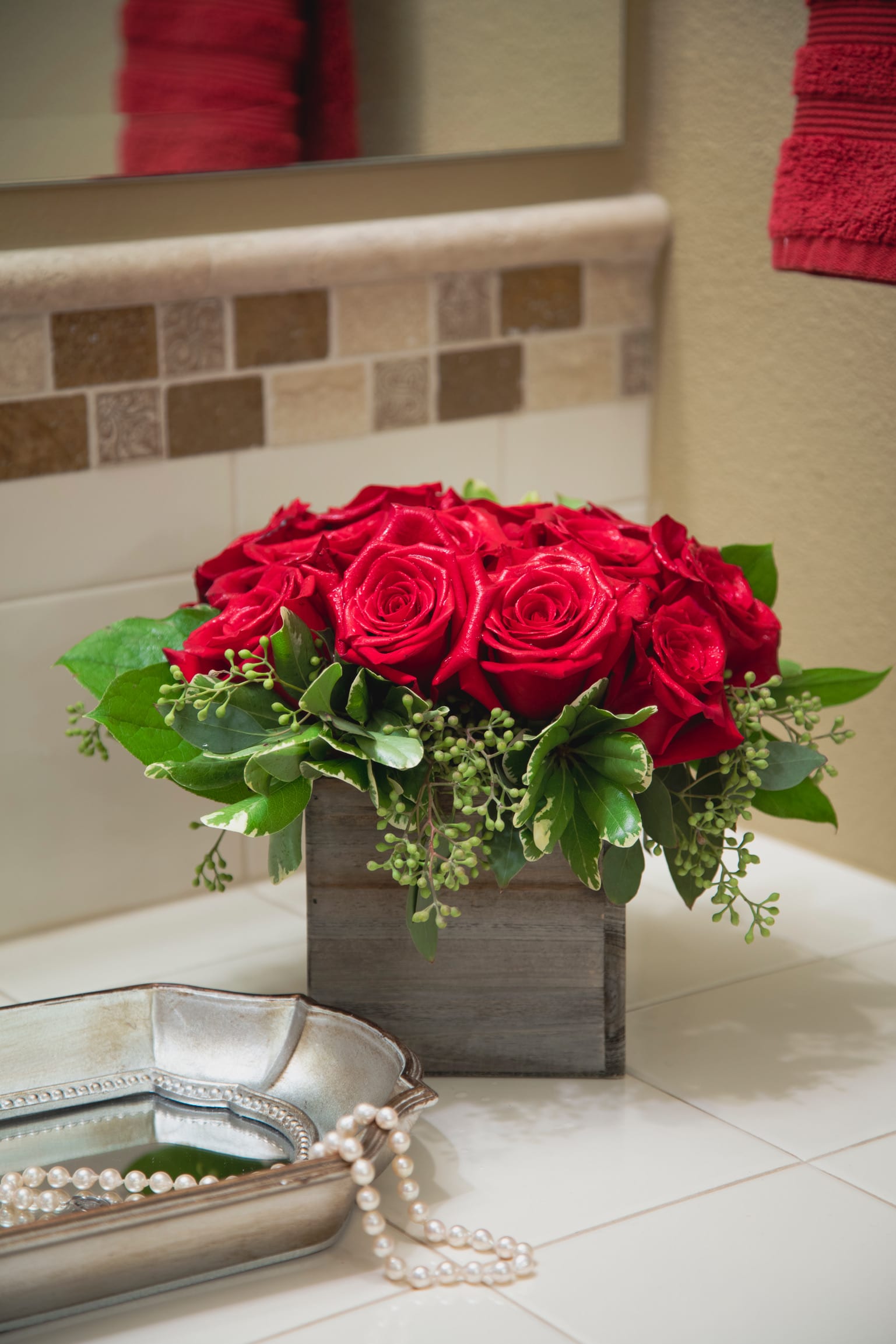 The Bloody Mary - 12 rich red roses in a rustic wood box will have your loved one screaming bloody murder in the best way possible. This simple but elegant design brightens up a room like no other!