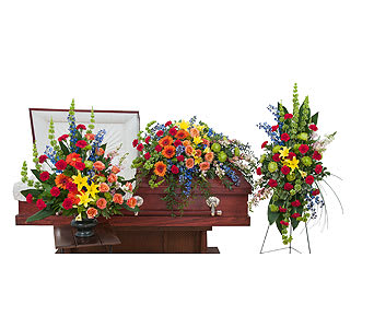 Treasured Celebration Trio - The treasured celebration trio includes a casket spray, standing easel spray and crescent urn arrangement.