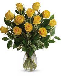 Dozen Yellow Roses - Express your affection with this classic gesture. One dozen of the finest yellow colored roses stand royally among shimmering accents of baby's breath. This gorgeous bouquet sends your message directly to the heart - give the thrill of friendship, romance or acknowledgment to someone special today! One dozen stunning yellow colored roses are expertly arranged with baby's breath, leatherleaf, and salal in a classic rose vase.