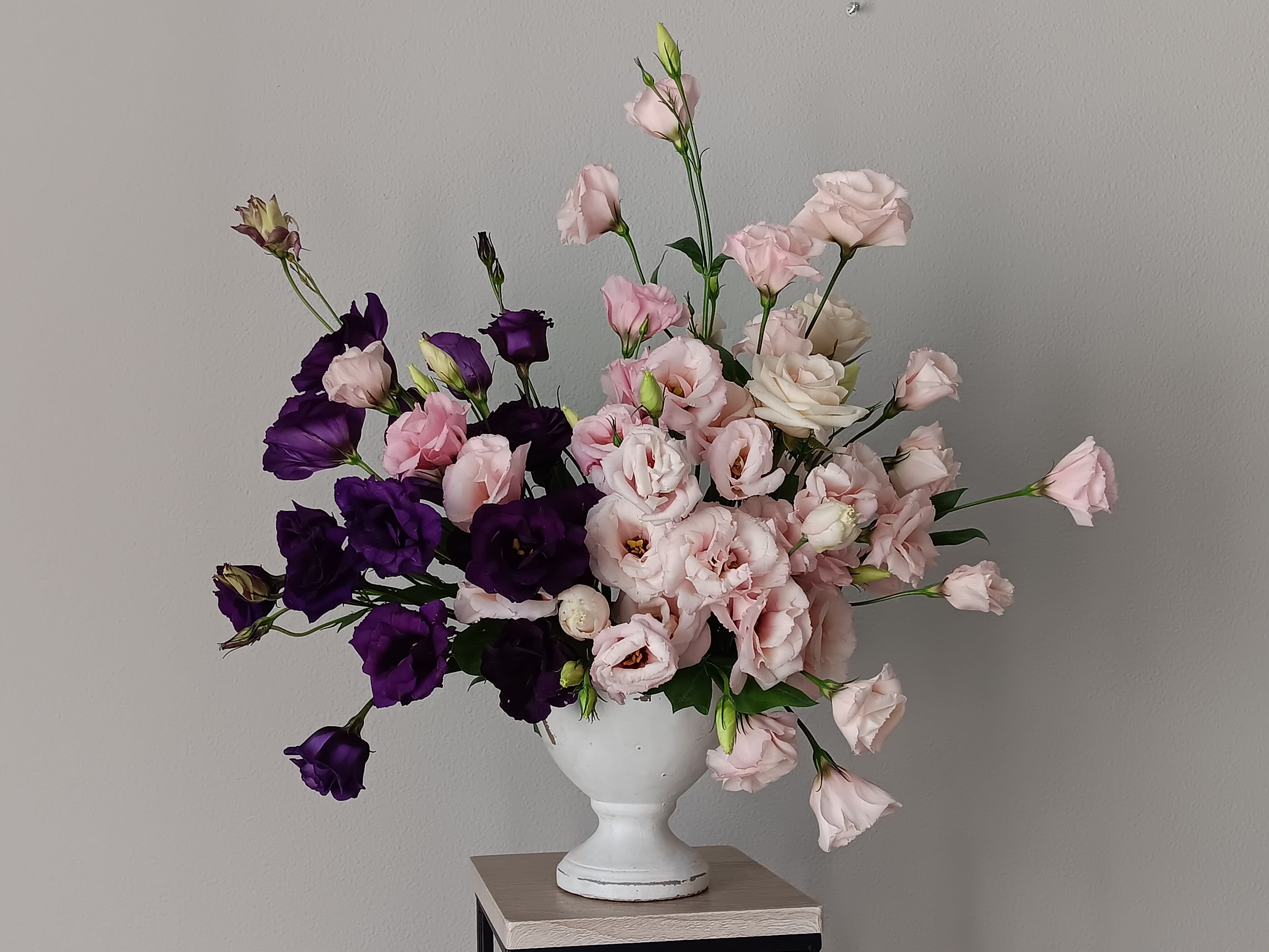 Breathless Bouquet - Bouquets featuring Long-Lasting Lisianthus Flowers Ruffled bell-shaped blooms, whether white, pink, lavender, purple or bicolor, the delicate appearance of the lisianthus brings its own special grace to a wide range of bouquets. Native to Texas and Mexico.  When this flower blooms to its fullest it can easily be mistaken for a rose. Their long stems and almond-shaped buds add a rustic and romantic look to any wedding bouquet, which is why they are popular with modern brides.  LISIANTHUS - can last 7-10 days Lisianthus have rose-like showy blossoms in grand colors, and with proper care they can last 7-10 days. Many of the unopened buds which show color may open fully. Smaller buds may not open but simply support the larger blossoms and accent the foliage.  SUBSTITUTION POLICY – Always deliver the freshest flowers! Please note the bouquet pictured reflects our original design.  If the exact flowers or container in this arrangement are not available, our local florists will create a beautiful bouquet with the freshest available flowers. 