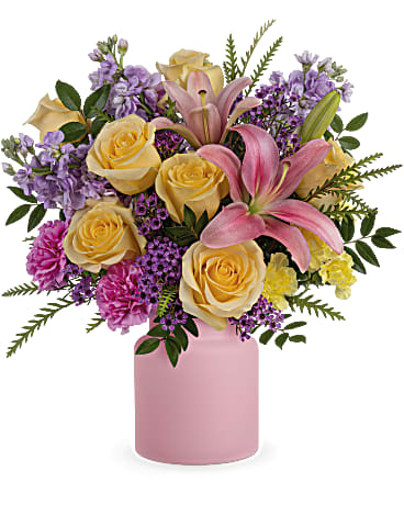 Cheerful Gift Bouquet - Cheers to you! Celebrate any day with this cheerful gift of pink lilies and yellow roses, delivered in a fun frosted glass jar. Pink asiatic lilies, light yellow roses, hot pink carnations, miniature yellow carnations, lavender stock and lavender waxflower are accented with huckleberry and grevillea. Delivered in the Savannah Jar. Orientation: All-Around 