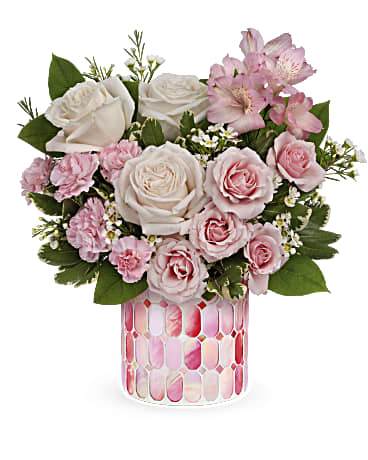 Sweet Clouds Bouquet Sweet Clouds Bouquet - Celebrate a special day with this sweet treat of radiant roses in a keepsake mosaic vase of candy-pink stained glass. Crème roses, pink spray roses, pink alstroemeria, miniature pink carnations and white waxflower are arranged with lemon leaf and green pittosporum. Delivered in Teleflora's Precious in Pink Cylinder. Orientation: All-Around