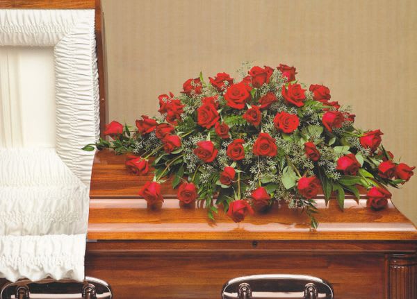 Red Rose Casket Spray - Casket cover made with red roses and luscious greens  - half casket (as seen): $250.00  - full casket $350.00.  Dimensions: 16&quot;H x 26&quot;D x 38&quot;L