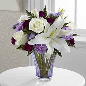 Thinking of You Bouquet Thinking of You Bouquet - Gorgeous white roses and white Oriental Lilies are perfectly offset by lavender carnations purple mini carnations and lavender statice to create an incredible flower arrangement. **We currently don't have this vase, we will make a substitution to make it as similar as we can**