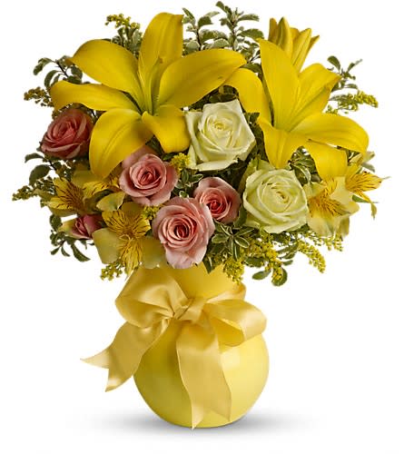 Teleflora's Sunny Smiles - What better gift to send someone than a sunny smile? Think how much that sentiment delivered in the form of this beautiful and cheerful bouquet will mean to whoever's on your mind today. Dazzling green roses peach spray roses yellow asiatic lilies alstroemeria and solidago along with beautiful leafy greens are delivered in a yellow Serendipity vase. Send a sunny smile today! Approximately 13&quot; W x 14 1/2&quot; H Orientation: One-Sided As Shown : T42-1A Deluxe : T42-1B Premium : T42-1C