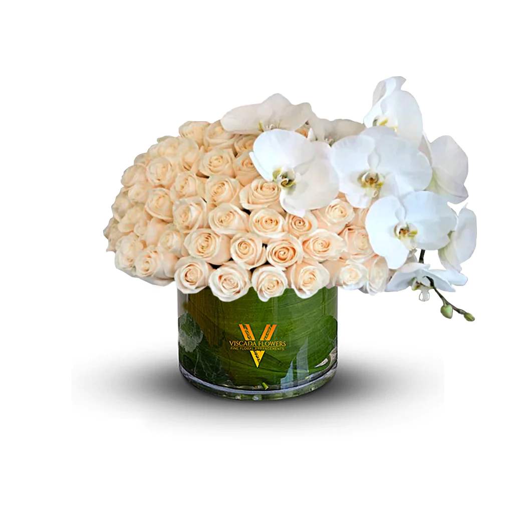 Kissed Clouds - Soft whites and subtle pastels come together in this ethereal arrangement, evoking the serenity of clouds kissed by the morning sun. Its delicate hues impart a sense of peace, making it a perfect choice for reflective or intimate occasions.