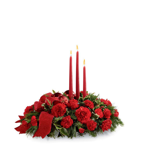 Lights of the season Lights of the season - A lovely centerpiece featuring red Carnations and mini Carnations with mixed Christmas greens. Includes 3 red candles. ***Candle and bow color may vary slightly with availability**