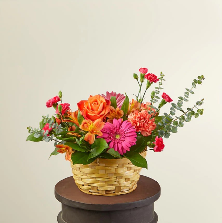 Sweet Treat Bouquet - Celebrate spring with our Sweet Treat Bouquet that arrives in an adorable basket ready for the spotlight. Designed with hot pink gerbera daisies and mini carnations to brighten any room, occasion or event, it's the sweetest treat you could send to a loved one.