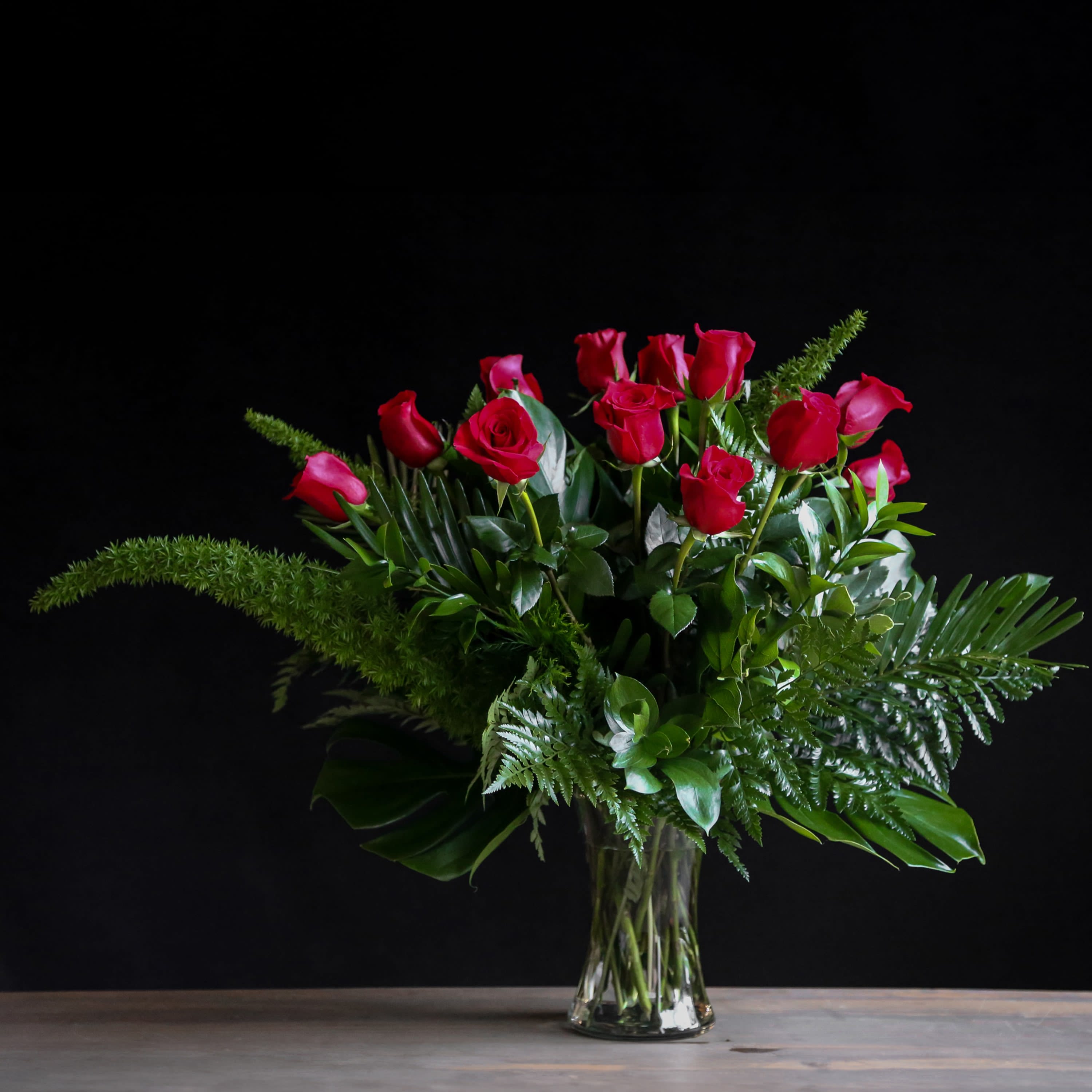 Jubilee - Bright roses touched with greenery make this a beautiful gift for anyone you love