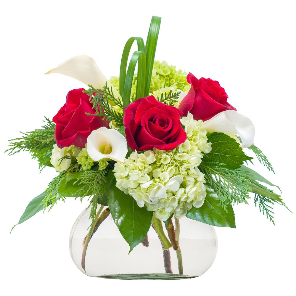 Ruby Slippers - This clear glass vase is filled with a combination of red and white flowers and winter greens to create a chic and romantic bouquet. This arrangement would be beautiful on a dining table, kitchen island, desk or coffee table.    Approximately 10&quot;W X 10&quot;H
