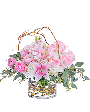 Peaceful Pink - In this peaceful and pink design, the curly willow encircles the combination of hydrangea, roses, lilies and ranunculus to draw attention to the premium delicate blooms. 