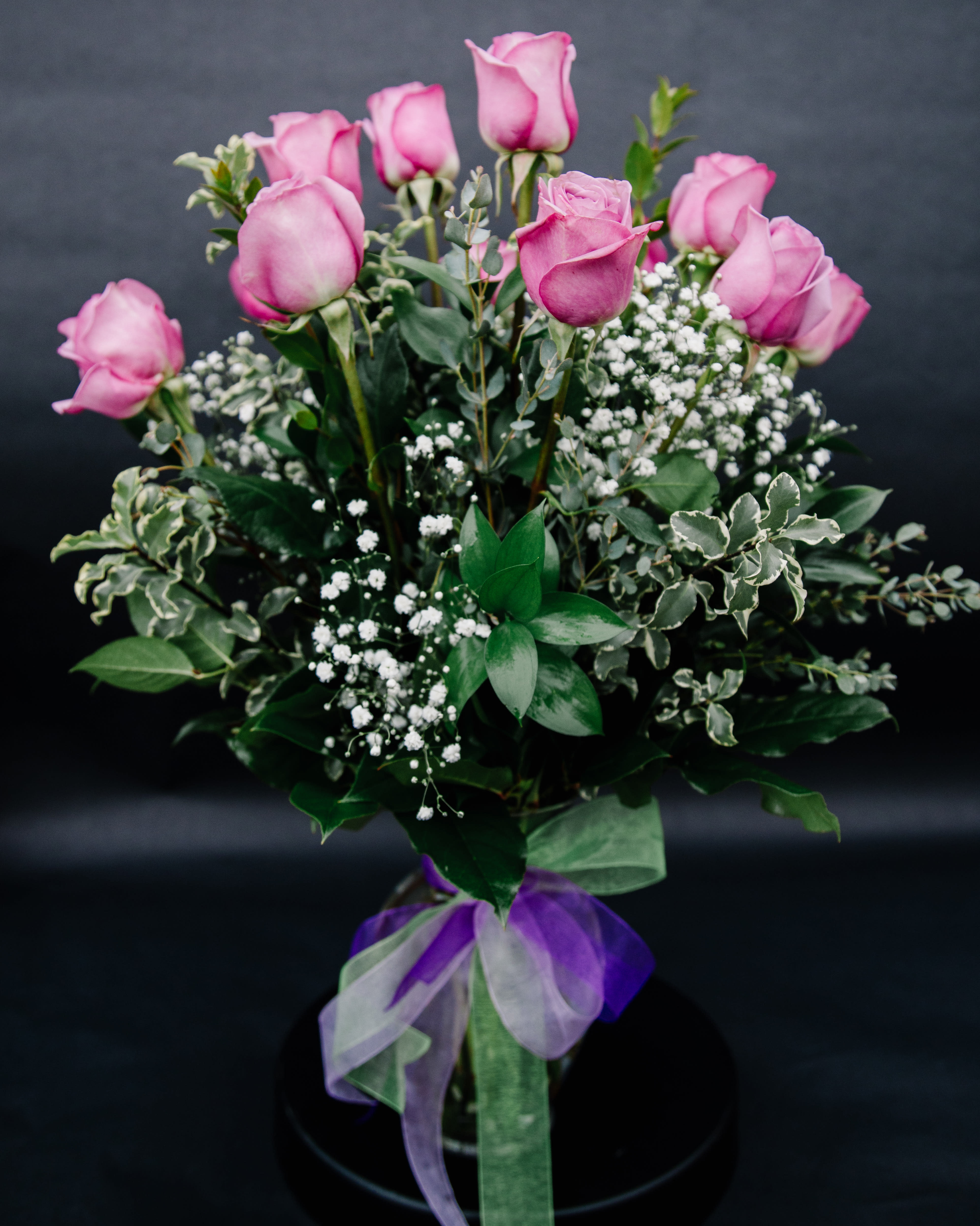 Lavender Wishes - Romantic roses with a lavender twist! A thoughtful selection for the purple-lover in your life, this arrangement of one dozen lavender roses features rich green salal and a touch of gypsophillia.