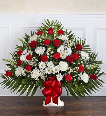 Red and White Floor Basket (FB9) Red and White Floor Basket (FB9) - Our elegant floor basket arrangement, handcrafted by our expert florists with radiant red and white blooms, is a tasteful gesture perfectly suited for the funeral home or memorial services.