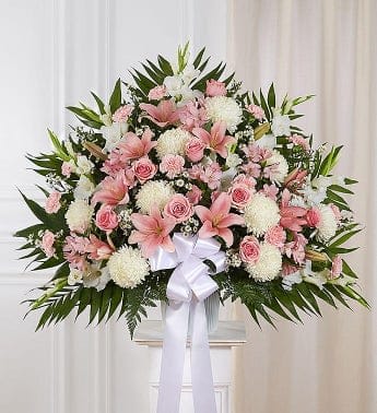 Heartfelt Sympathies Pink & White Basket (FB10) Heartfelt Sympathies Pink & White Basket (FB10) - Our majestic pink and white standing basket arrangement will honor the memory of a loved one in an impressive and meaningful way. Artistically designed by our expert florists with a medley of pink blooms, it is a heartfelt expression of your deepest sympathies.