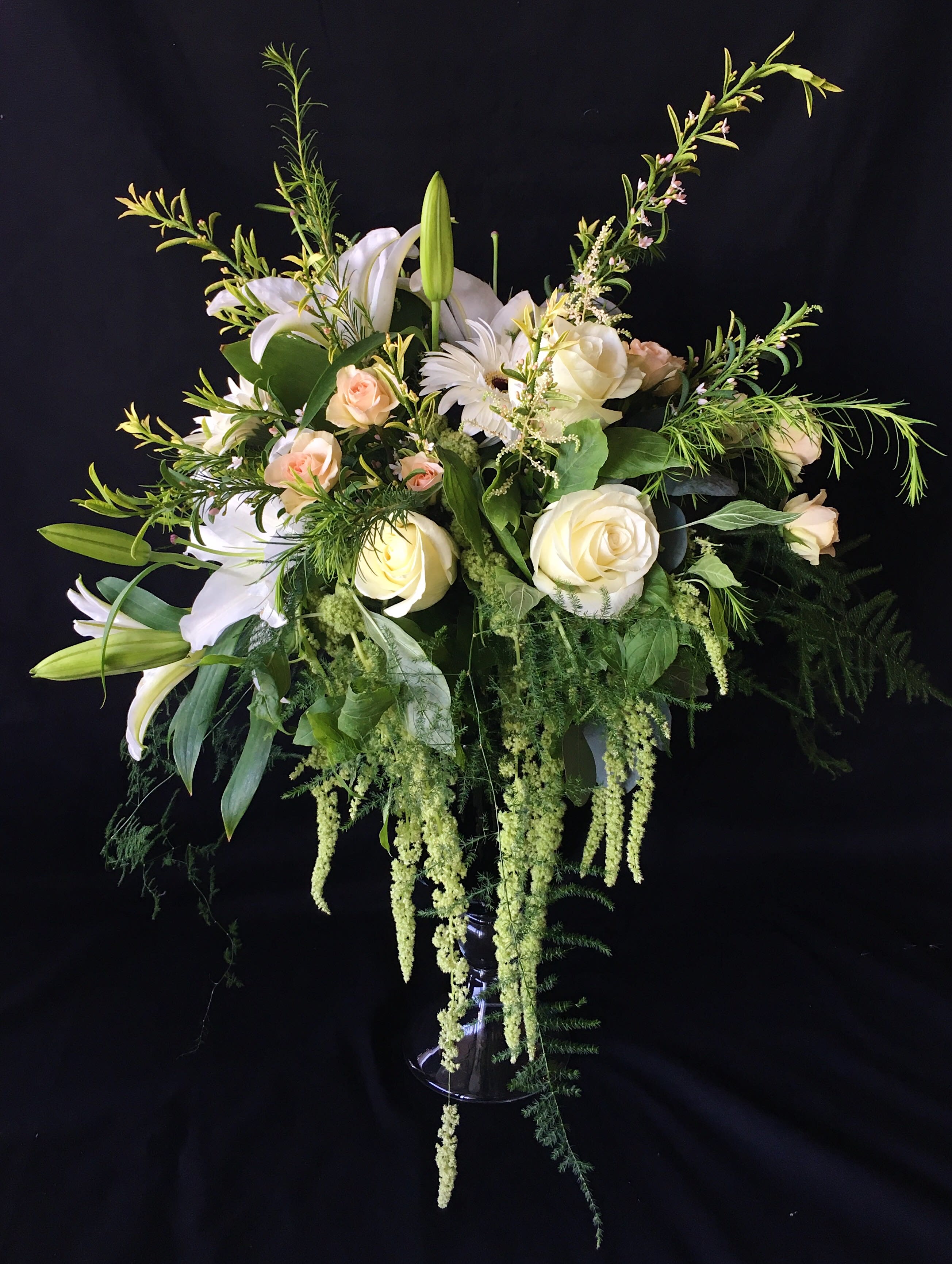 Simple Beauty - Features a variety of flowers such as; white gerberas, white lilies, and green hanging ameranthus to give that simple yet elegant look.    *Flowers subject to change based on supply*