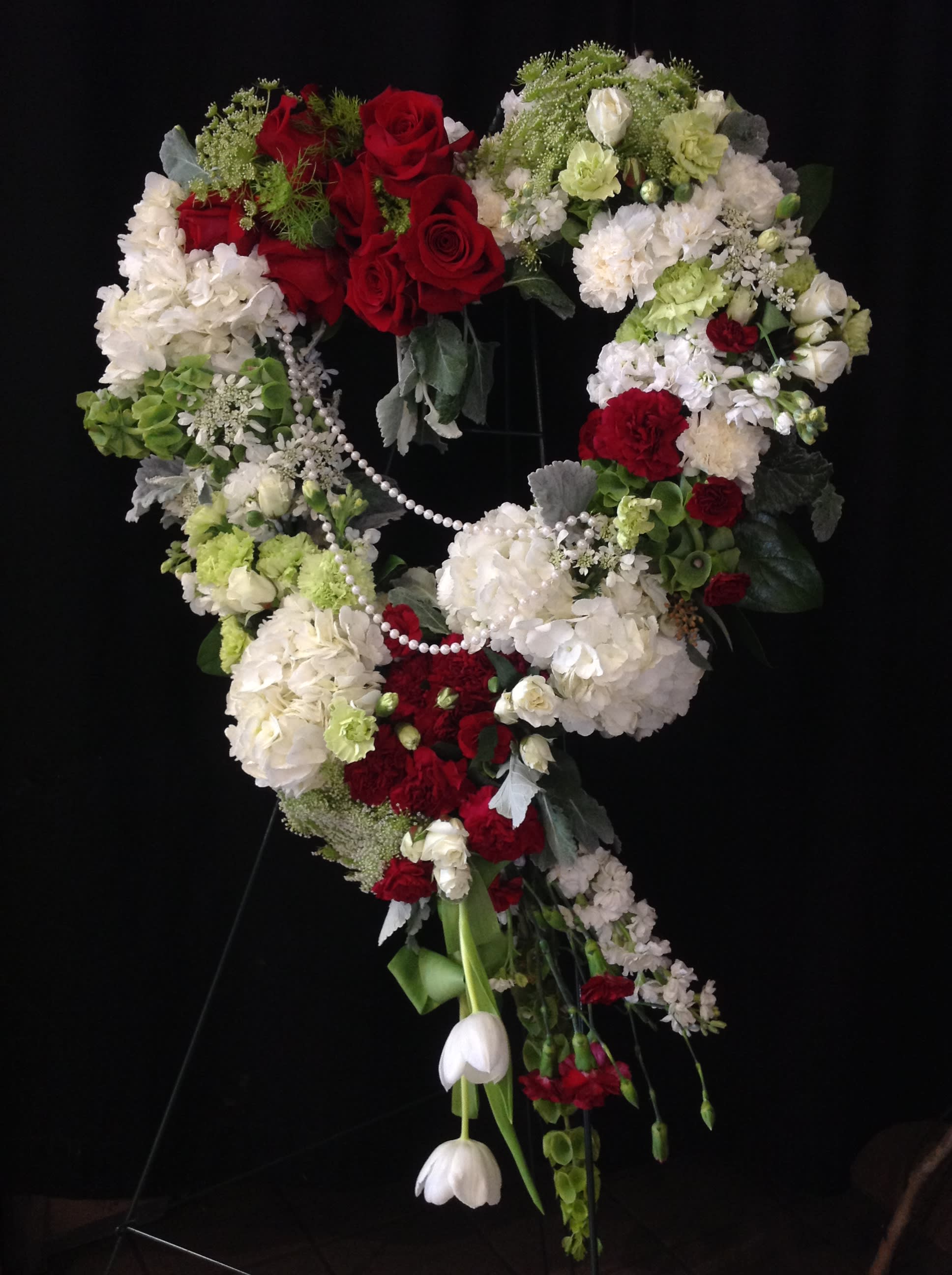 Tenderness - Red and white heart standing spray with draping pearls   *Flowers subject to change based on supply*