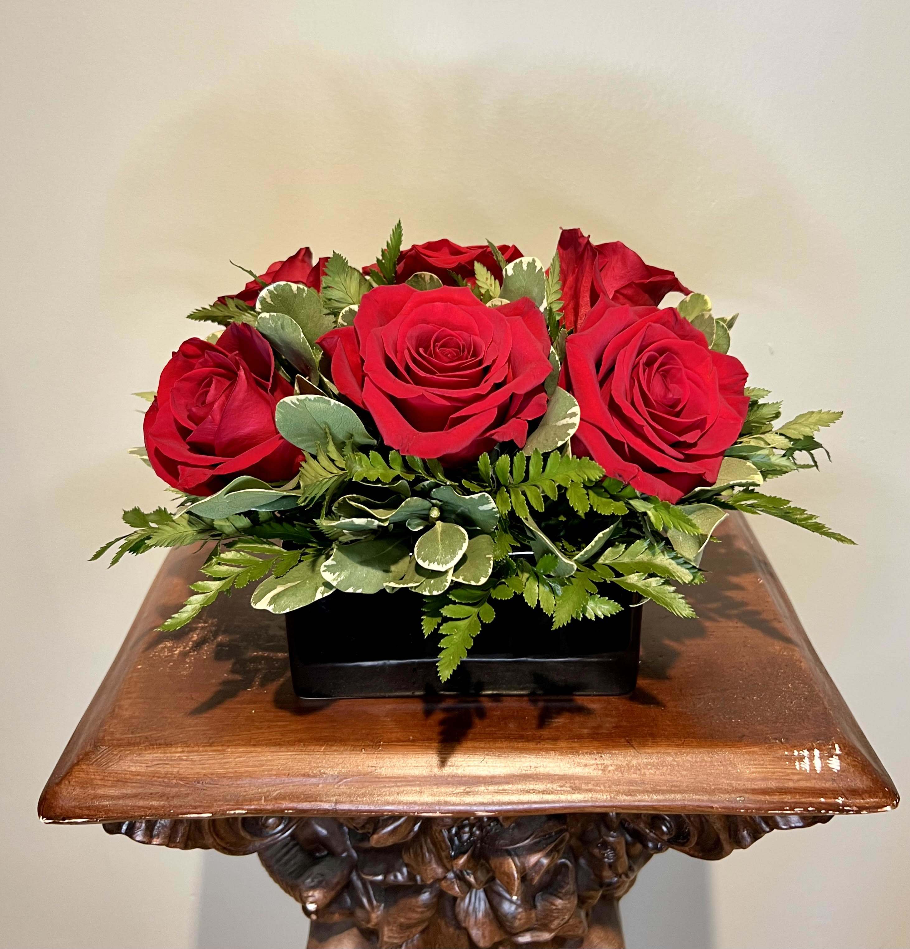 Pave Romance Pave Romance - This half dozen roses are arranged with a modern pave twist. Surly to bring a smile to your loved ones face, this bouquet is perfect of the office or on a bed side table.