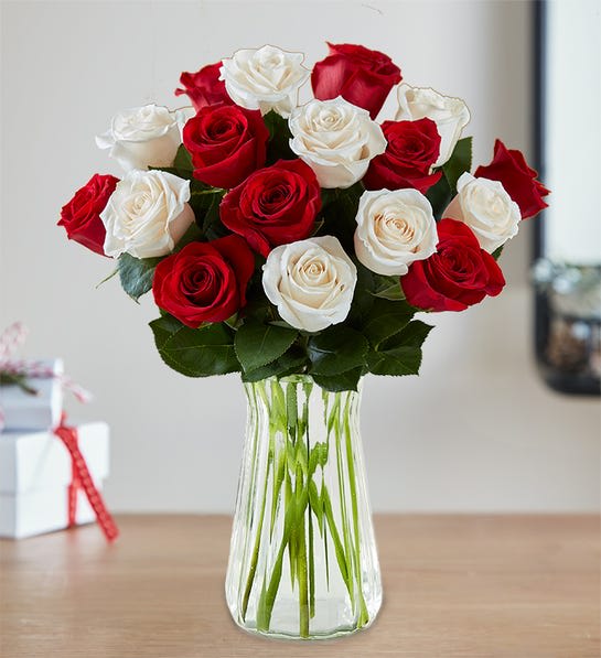 Peppermint Rose Bouquet - Capture the spirit of the season with our fresh peppermint rose bouquet. Inspired by the classic pinwheel candy, our festive red and white blooms come in gatherings of 18 stems. It’s a special holiday treat that’s sure to warm the hearts of family &amp; friends.