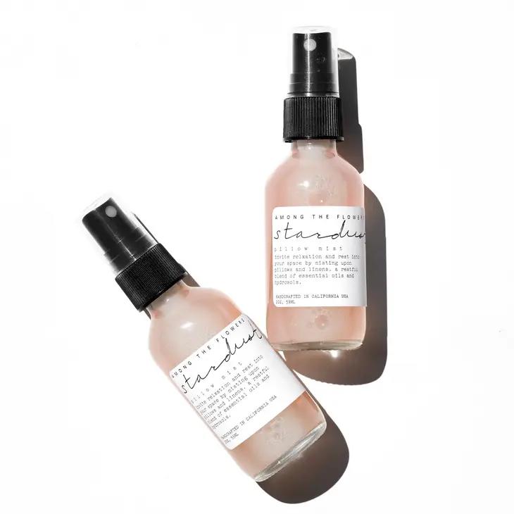 Stardust Pillow Mist Stardust Pillow Mist - Lull away the afterthoughts of today with the calming, relieving floral waters and essential oils combined in this mist for their soothing attributes. We created this mist paying special attention to the delicate nature and benefits of each ingredient. With a combination of essential oils that, together offer calming, sedative, stress-lifting and anxiety reducing properties. 2 oz Use: Mist upon pillows, face, hair, skin, towels... you get the idea. Ingredients: Lavender floral water, witch hazel, essential oils of: ylang ylang, lavender, cedarwood, frankincense, Himalayan pink salt