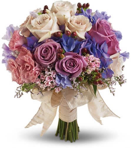 Country Rose Bouquet - Dusty lavenders soft mauves and creamy whites create a charming country-inspired bouquet. Pink bouvardia lavender hydrangea lavender and cr?me roses pink limonium pink lisianthus and lavender sweet pea with red hypericum.Approximately 12 1/2&quot; W x 14&quot; H Orientation: N/A As Shown : DGT194-4A
