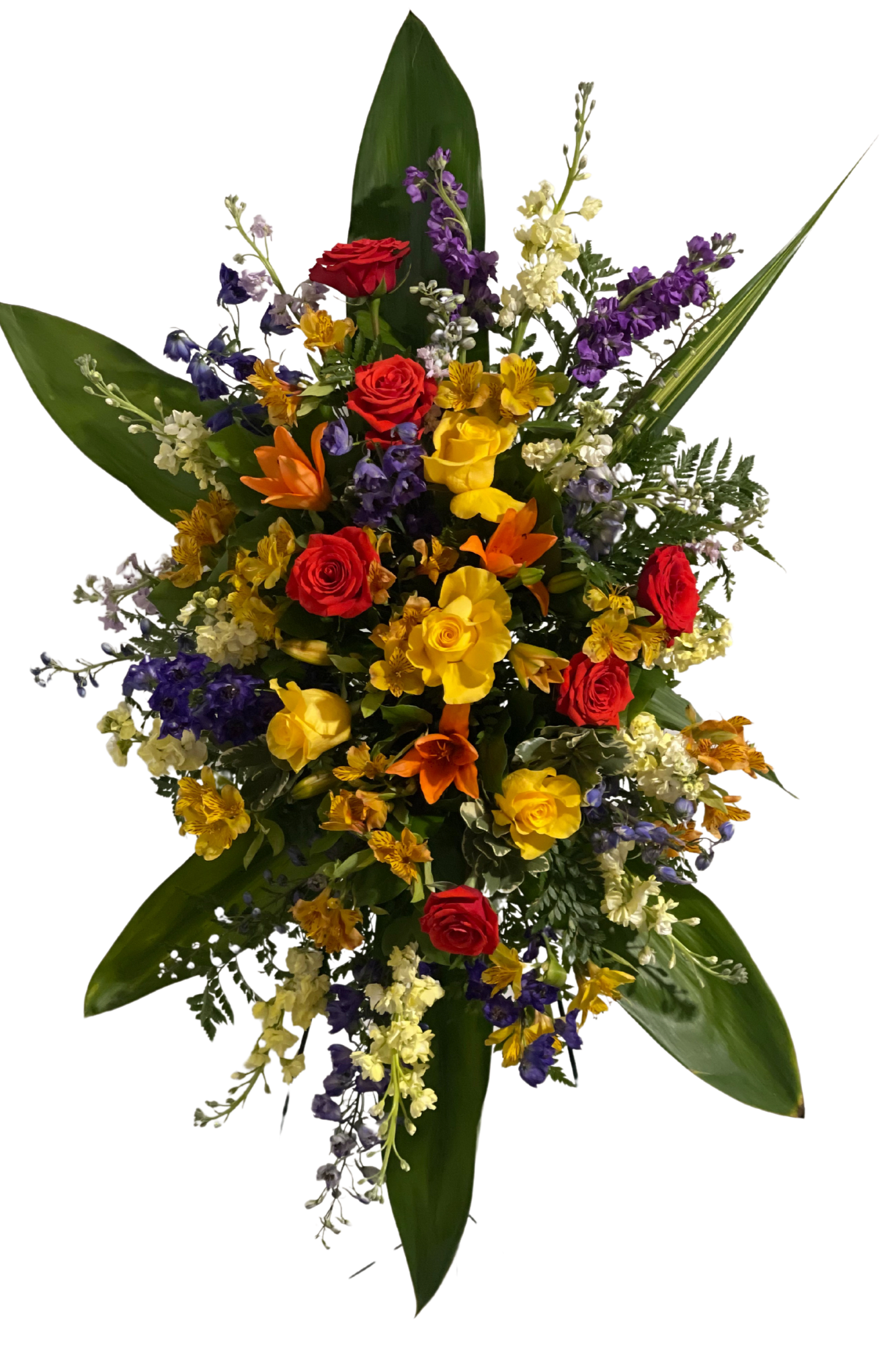 Colorful Kaleidoscope Tribute - Our Colorful Kaleidoscope Tribute standing spray is a stunning and vibrant tribute to celebrate the beautiful life of your loved one. This arrangement features a beautiful combination of colorful flowers, including lilies, alstroemerias, roses, stock, and larkspur, creating a kaleidoscope of colors that represent the vibrance and joy of life.  The magnificent lilies represent purity, innocence, and the restored innocence of the soul while the alstroemeria symbolizes devotion, friendship, and loyalty. The roses are a classic symbol of love and admiration, and the stock flowers represent the bonds of affection that last beyond the physical world. The colorful larkspur is a symbol of lightness, playfulness, and laughter.  The Colorful Kaleidoscope Tribute standing spray is a reflection of the many beautiful and meaningful relationships that exist in our lives and pays tribute to the memories shared with our loved ones.  Order the Colorful Kaleidoscope Tribute standing spray to celebrate the joy and beauty of the life of your loved one. Let the kaleidoscope of colors be a comfort and solace during this difficult time