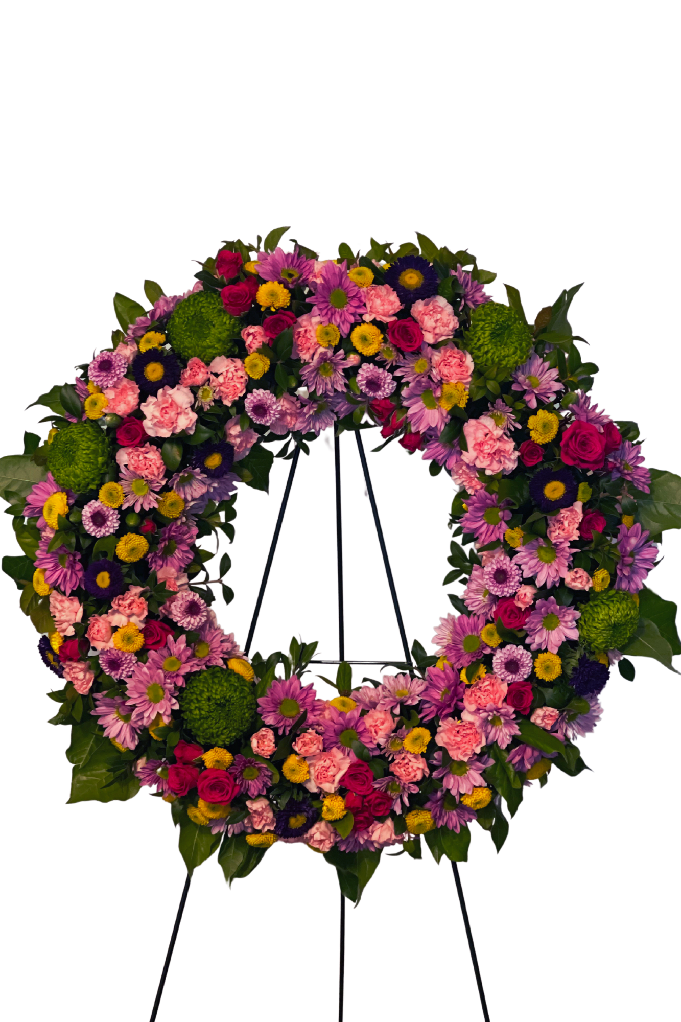 Reflections Tribute - Our Reflections Tribute standing spray is a beautiful way to honor the life of a loved one who is no longer with us. The stunning mixed flower arrangement includes an array of colors and textures, featuring white chrysanthemums, elegant carnations, and delicate mums, along with a variety of seasonal flowers.  This standing spray is both beautiful and understated, with its elegant combination of mixed flowers and greenery giving it a timeless appeal. The diversity of colors and textures in the arrangement offers a reflection of the diversity of life that your loved one may have experienced.  The Reflections Tribute standing spray is the perfect way to convey your sympathy and offer comfort to those who are grieving. It is a beautiful tribute to a special person who will leave a lasting impression and show your support and respect during this difficult time.  Order the Reflections Tribute standing spray today and let its natural beauty and elegance be a reflection of the life and memories of your loved one that will be cherished for many years to come.