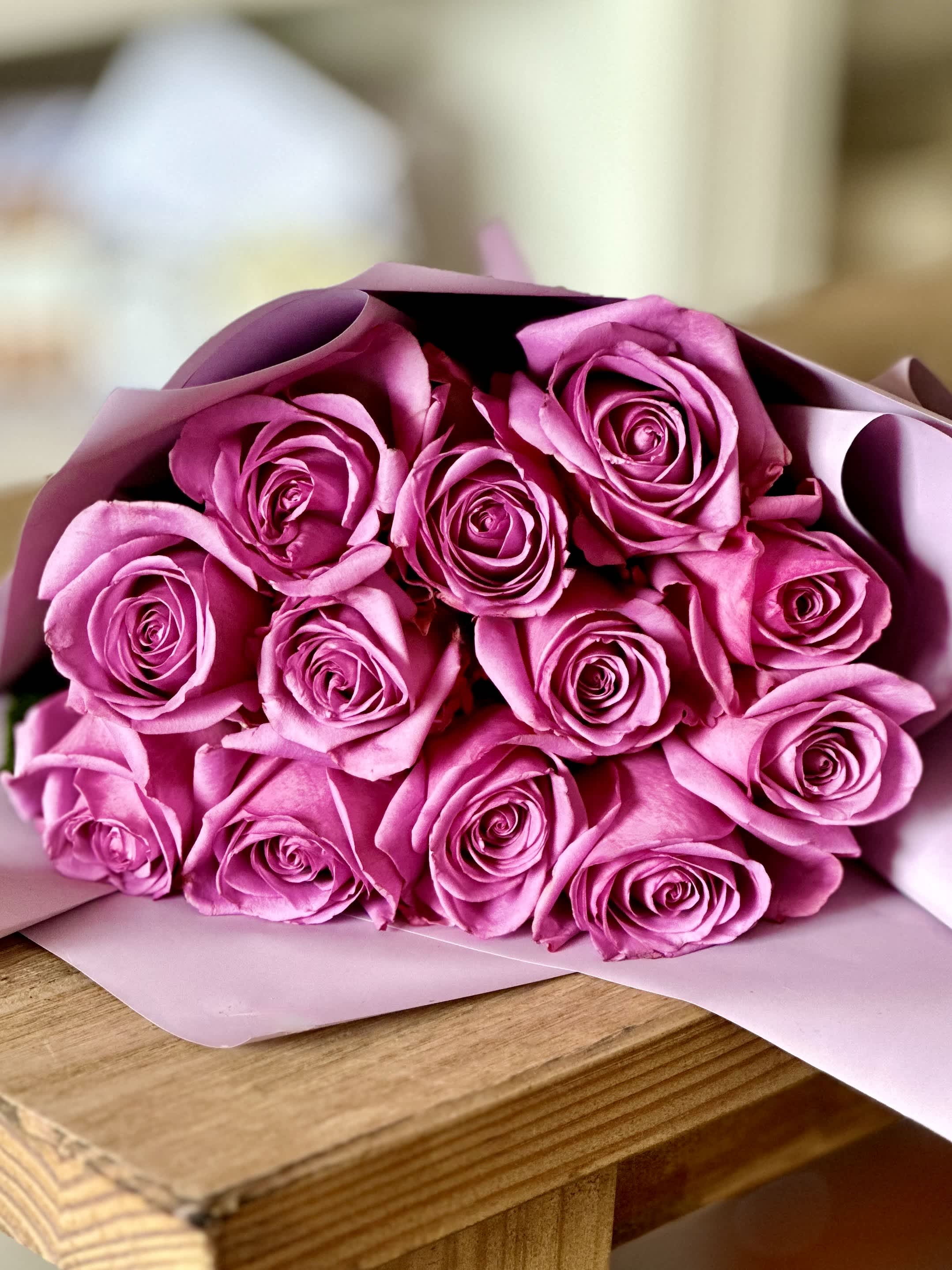1 dozen Lavender Roses  - 1 dozen Lavender roses wrapped in paper.