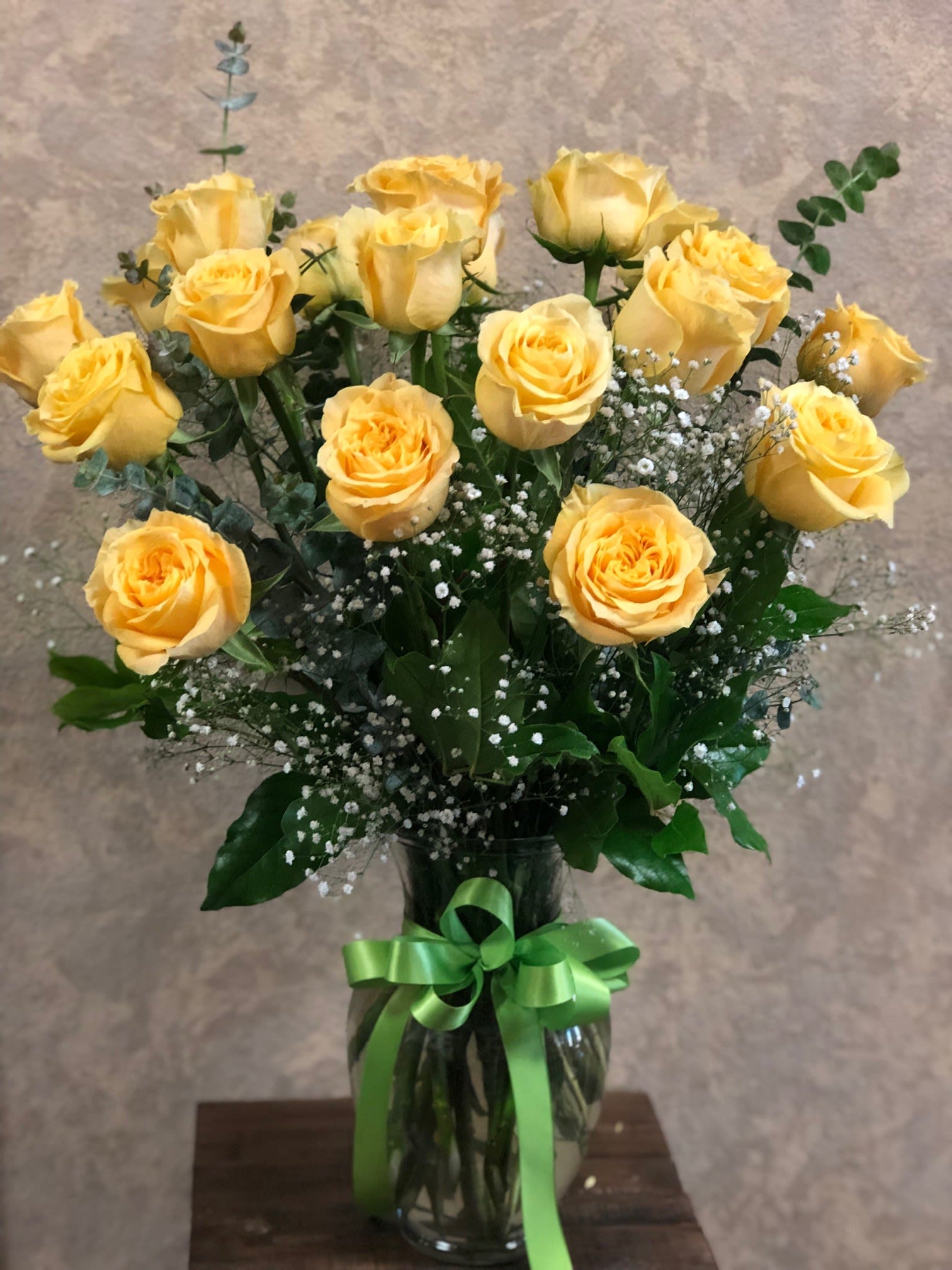 18 Premium Long Stemmed Yellow Roses (available in all colors) - Premium Long Stemmed Ecuadorian roses with green ribbon. These Yellow Roses with baby's breath will be a perfect friendly gift to say thank you or cheer someone up!  Other color roses are available. Please let us know in special instructions.  APPROXIMATE DIMENSIONS: 25&quot; H X 18&quot; W