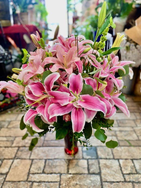 Just Lillies Just Lillies - An enormous arrangement made entirely of just lilies and greenery, Just to let you know, vases may vary but we do our best to match the arrangement shown.