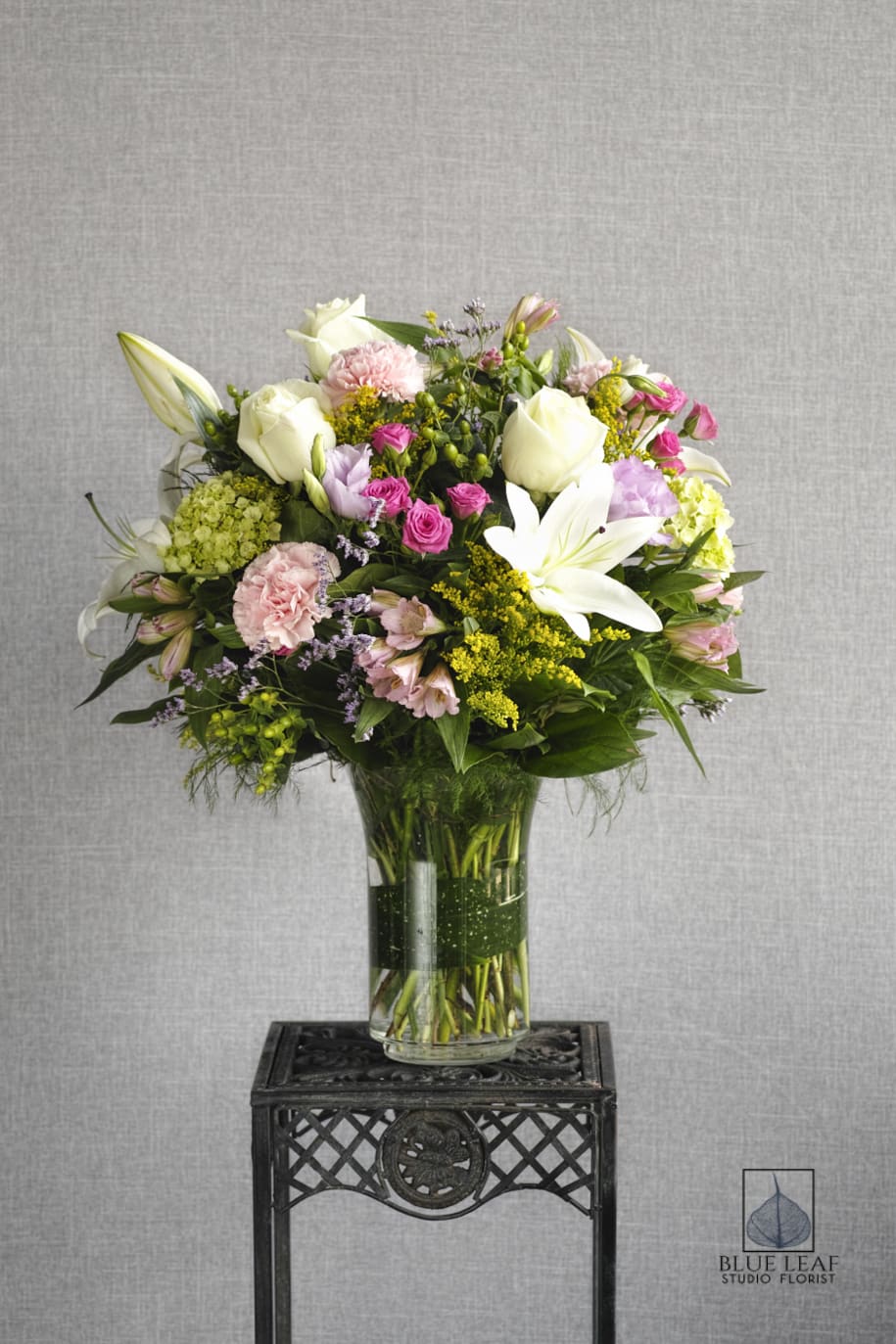 Sweet Garden Mix - This bouquet is a lovely mixture of sweet heart roses, large roses, lilies, soft pink carnations and seasonal accent flowers. A fabulous choice for any occasion.