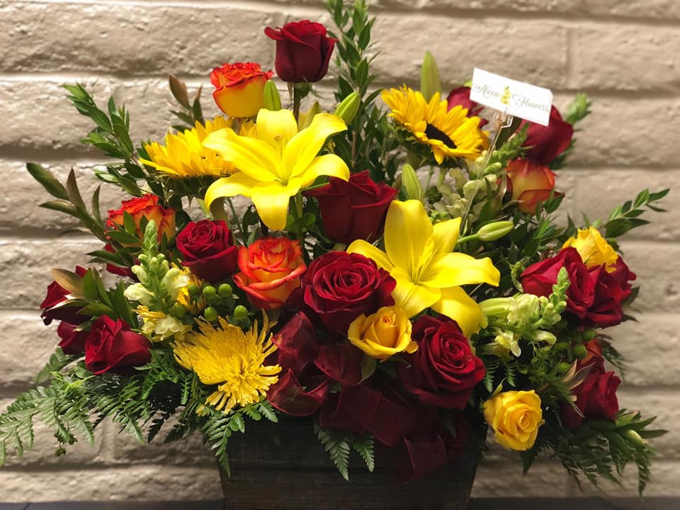 SEE ME BOX (DESIGNER CHOICE) SEE ME BOX (DESIGNER CHOICE) - A MIXTURE OF COLORFUL FLOWERS IN A WOOD BOX . A mixture of 9 Roses and other flowers this measures about 18 inches tall and about 12 inches wide