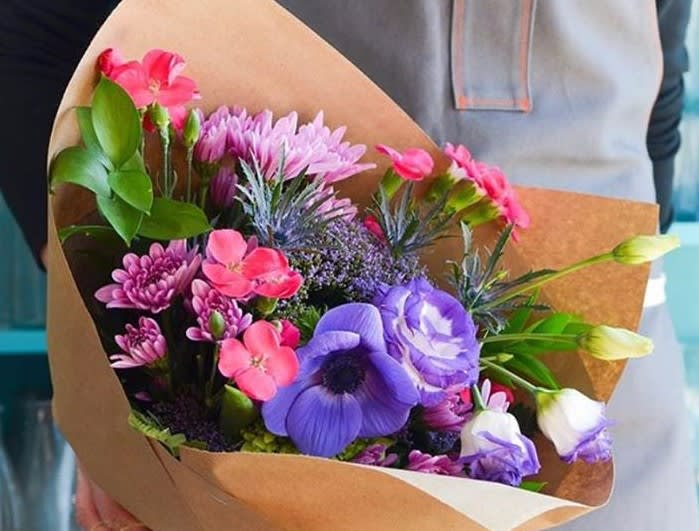 Designer's Choice - Seasonal Hand-Tie Bouquet - Let us design a beautiful and distinctively unique bouquet from the freshest flowers and premium greens in our shop. Our designer's hand select a seasonal mix of farm-direct fresh flowers and wrap each bouquet by hand. Each bouquet can easily be displayed in the lucky recipient's personal vase, sure to enjoy upcycling their own container - recycle, reuse, re-purpose.  Please note, this image is simply an example and not an exact interpretation of available product per order. We do not recommend sending this into a hospital setting or facility without proper onsite maintenance materials.