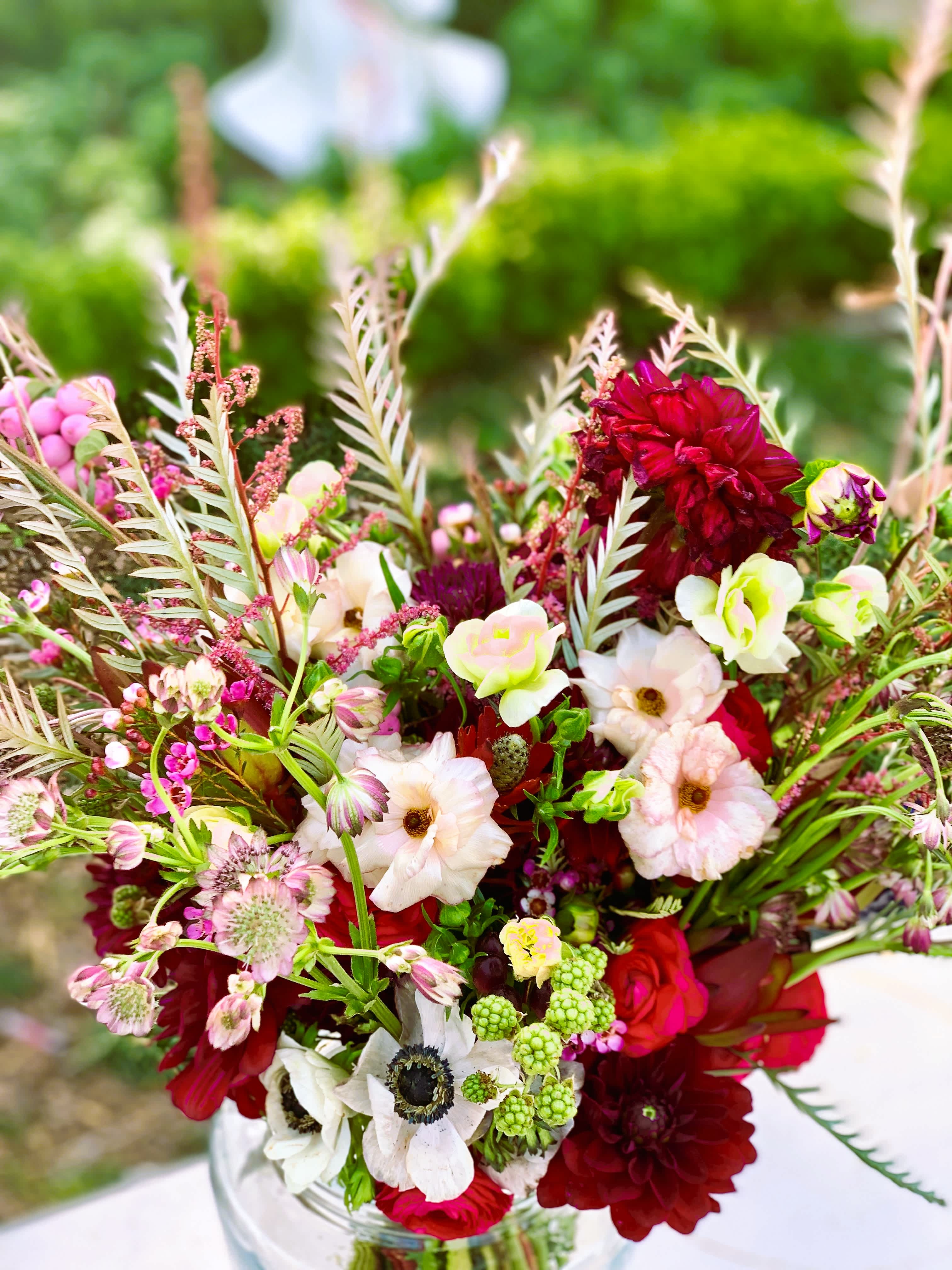 the &quot;Alexandra&quot; - This wild and romantic bouquet of red shades and bold foliage is also filled with delicate blooms and subtle beauty.  *All Bouquets can also be arranged in vases or containers