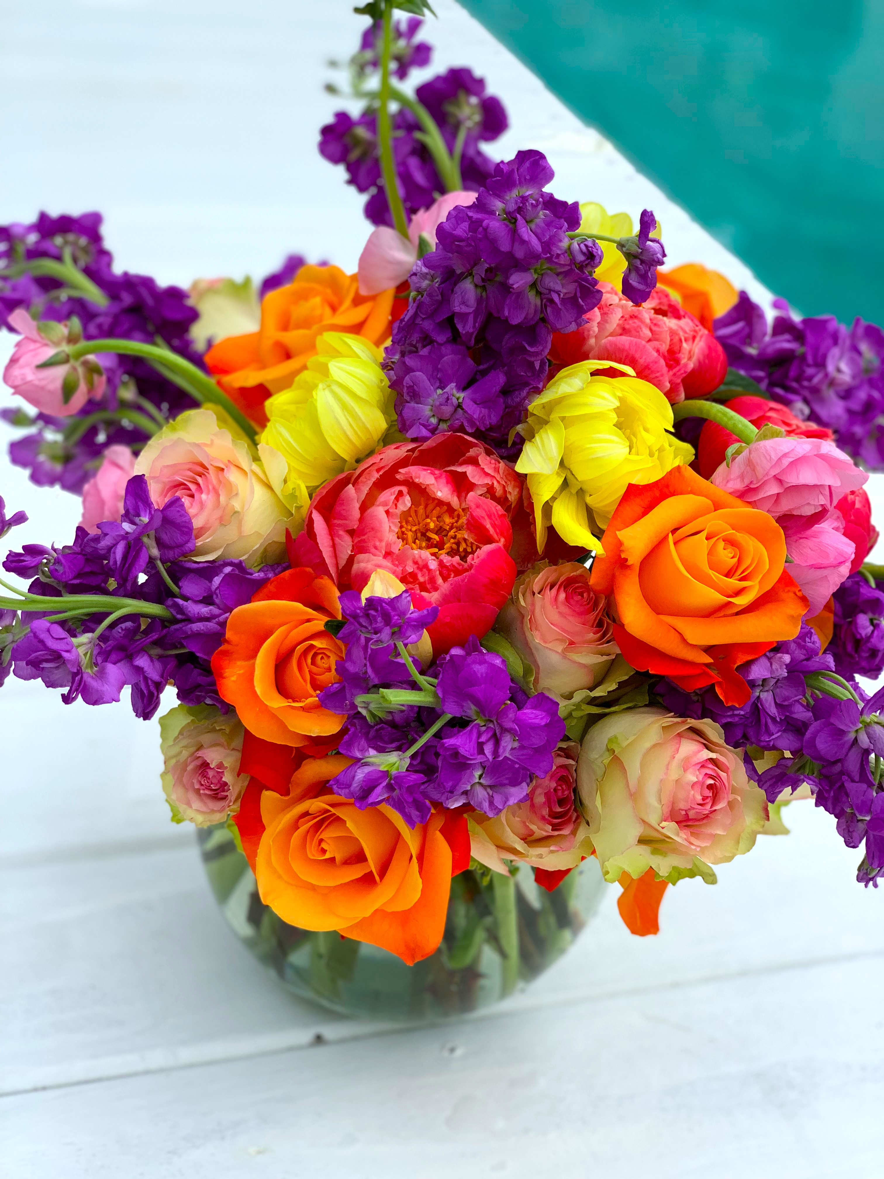 Bright & Bold Bright & Bold - This arrangement packs a powerful punch. Filled with incredible shapes and textures, the colors meld together to make a visual feast. And the lack of greenery or filler makes this modern compact piece a blooming showstopper!