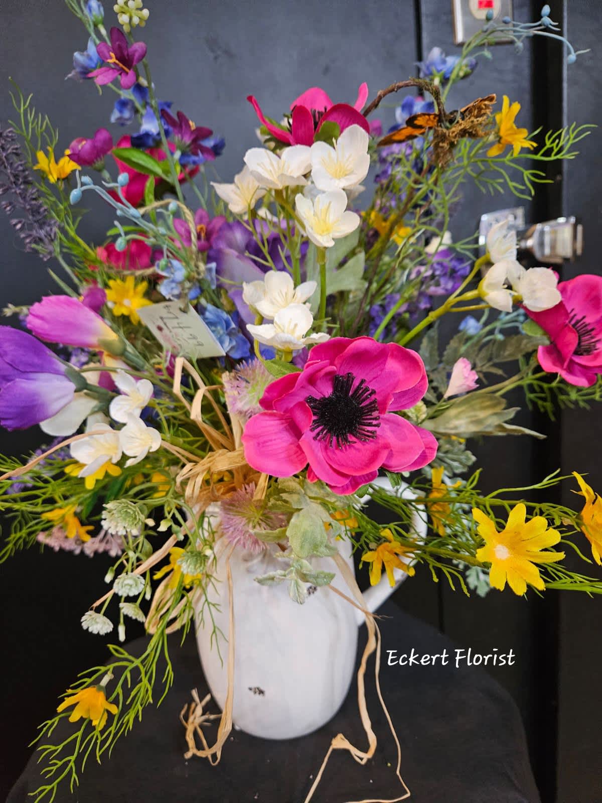 Eckert Florist's Artificial Pitcher Bouquet - Designed in a ceramic pitcher, this one of a kind artificial silk flower arrangement measures approx 21.5&quot; High x 21&quot; Wide *Our local delivery only
