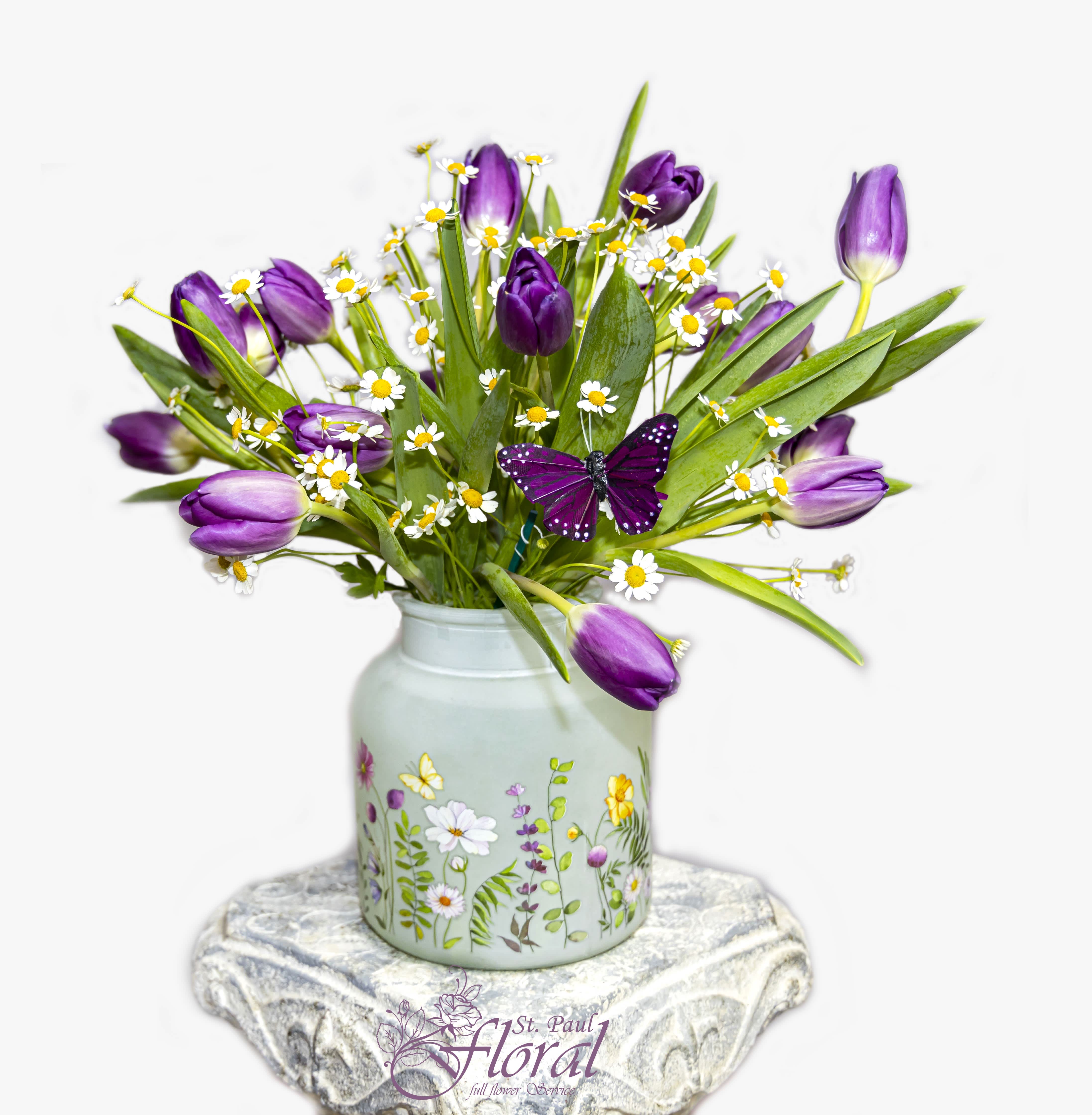 Spring Solstice - When you think of Tulips, what does it remind you? This vibrant purple Tulips will remind you of Spring, contrasting with Feverfew arranged in a Spring pattern vase.