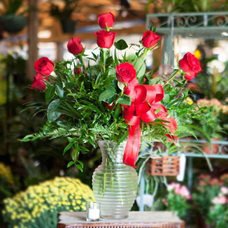 Red Roses Vased - A dozen of the freshest red roses available with greens. This arrangement is great for any occasion.