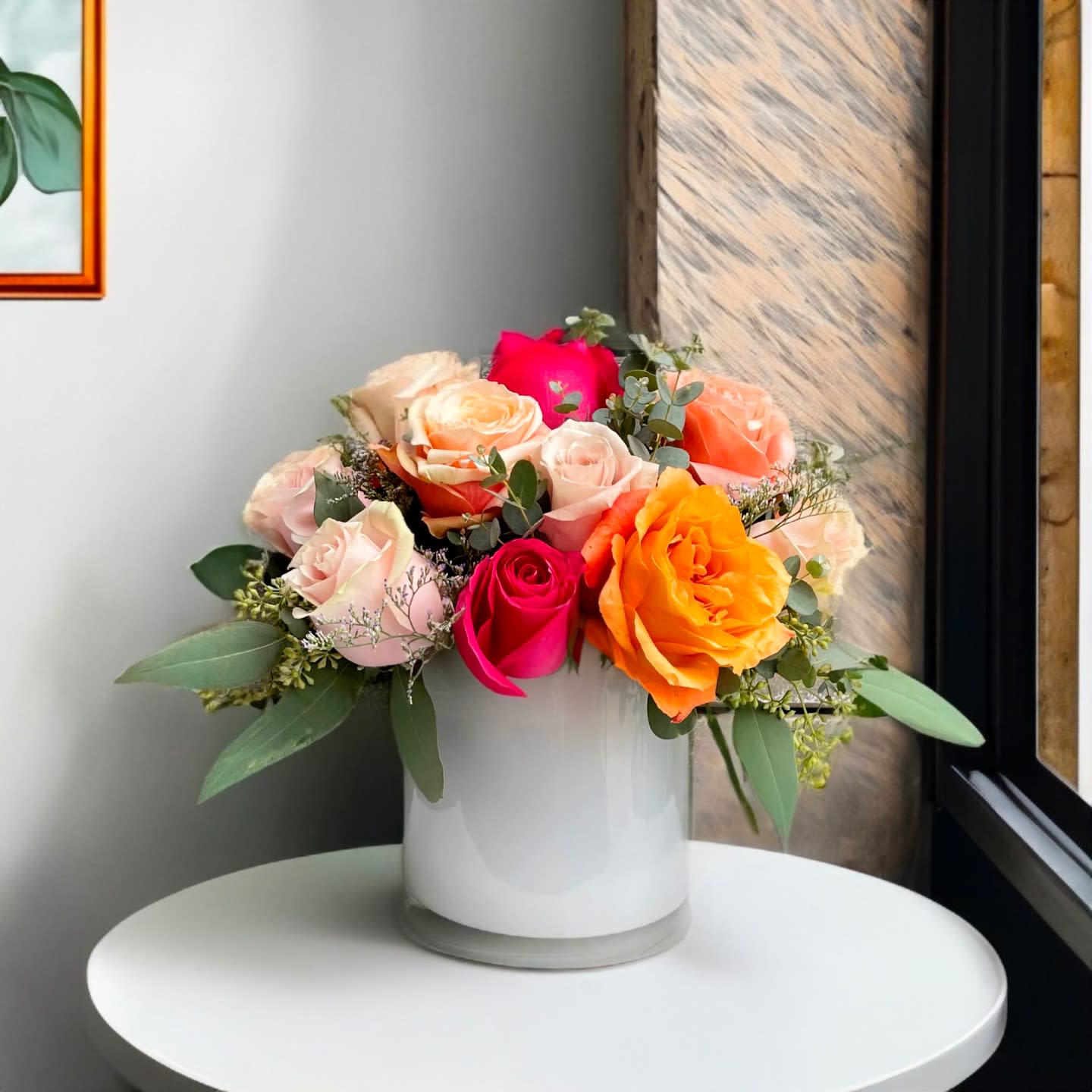 Tuscan garden Tuscan garden - Roses in a soft pink and sunset combination with soft elements in a white contemporary clean ceramic vase greened with fresh seeded eucalyptus for a soft but classic feel