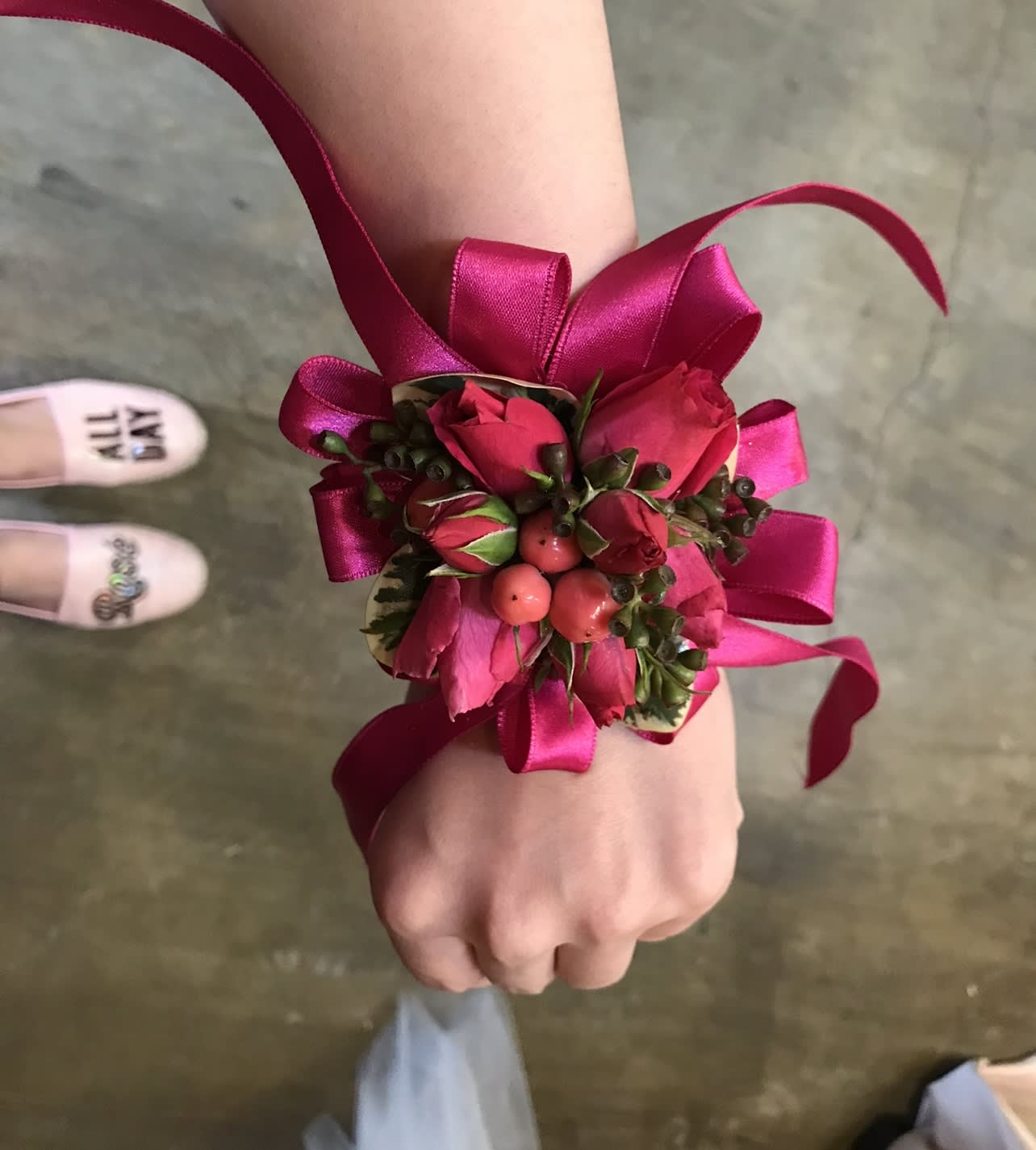 Red corsage  - A classic red rose and coffee bean corsage compliments any outfit.  Perfect for prom, formal, and weddings. Substitution Policy In some instances, our photo may