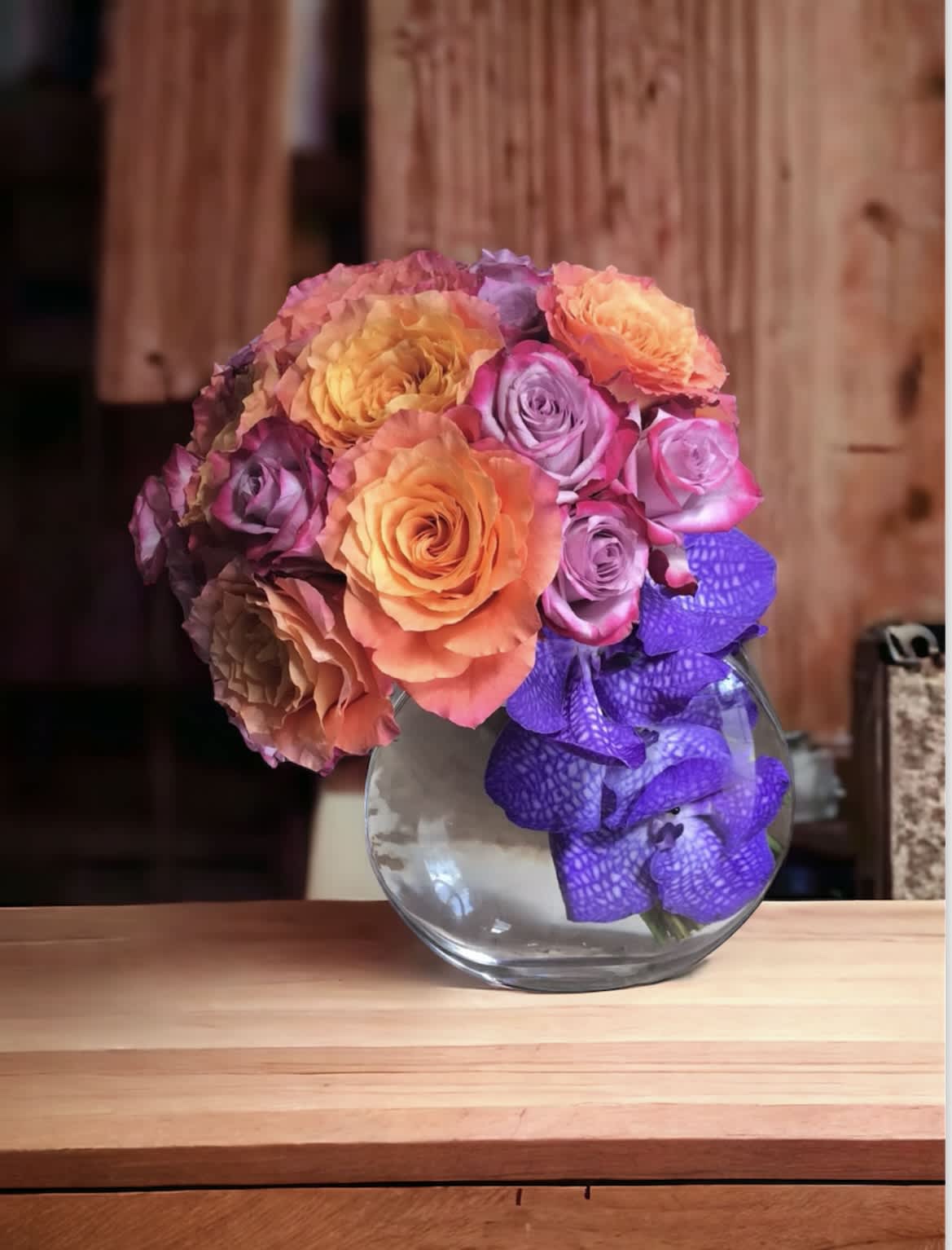 Orange halfmoon  - Flower: Orange roses, Purple roses mix bouquet with purple Vanda Vase : H 8 : W 9 half moon clear vase